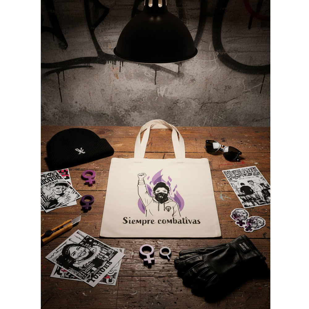 Bolsa Siempre Combativas de Ouh Rebel sobre fondo de ladrillo visto.