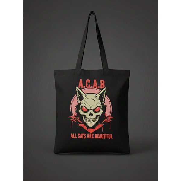 Tote bag negra con diseño de cráneo de gato y lema All Cats Are Beautiful.